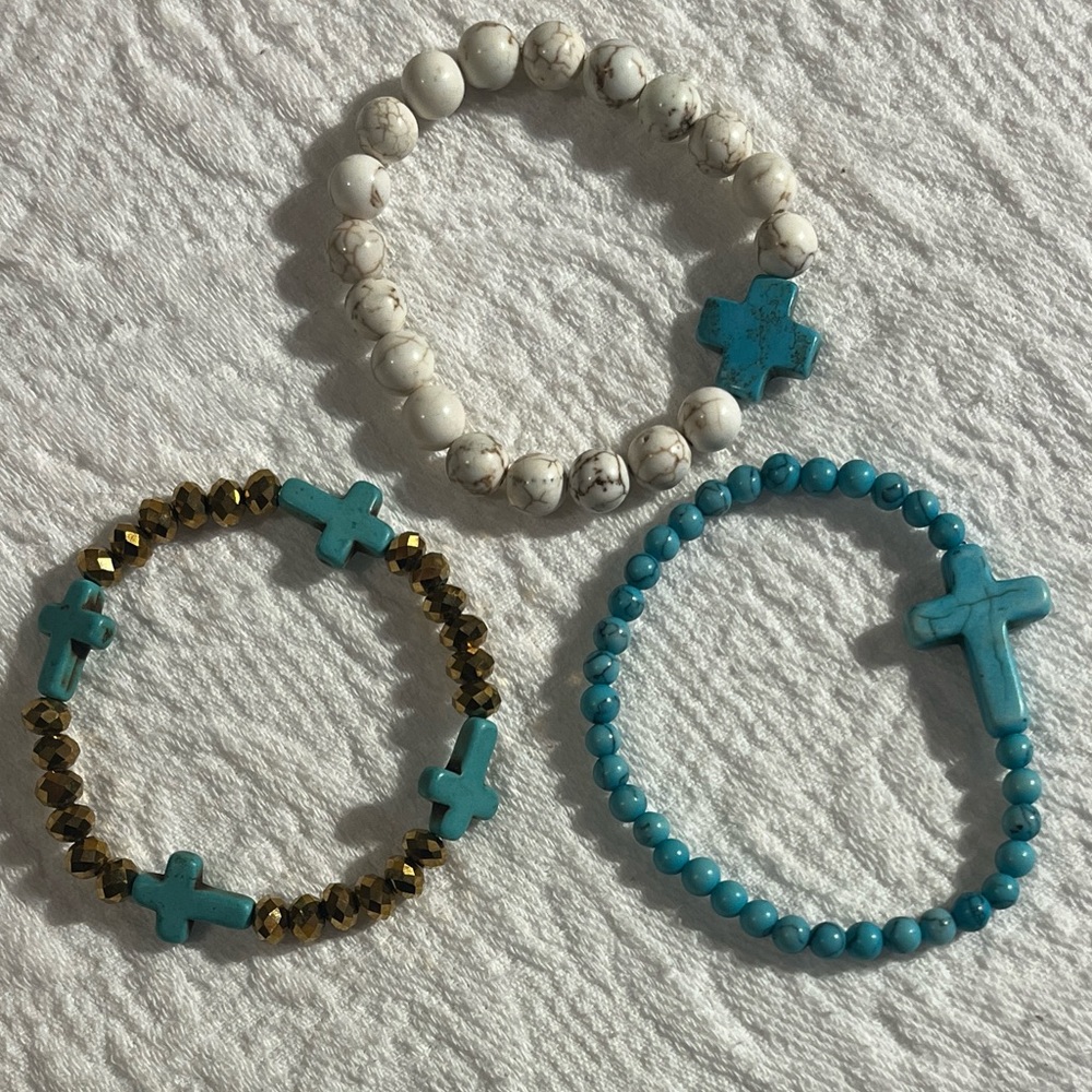 Collection of three dainty delightful beaded bracelets with crosses